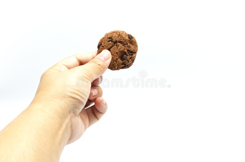 hand-holding-cookie-chocolate-chip-white-background-copy-space-hand-holding-cookie-chocolate-chip-159129311