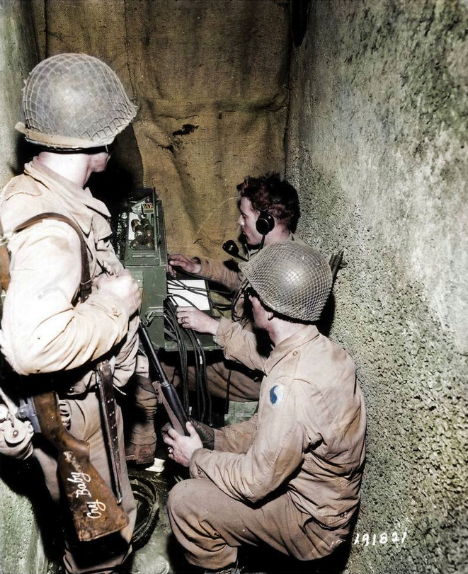 Signal_Corps_troops_of_the_29th_Division_operate_a_BD-72_12_line_telephone_switchboard_in_St_Lo,France.