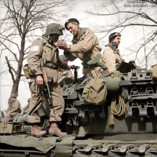 A_paratrooper_from_the_American_17th_Airborne_Division_gets_a_light_from_a_Churc